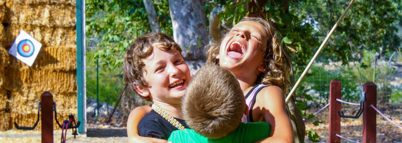 Campers huggin and smiling