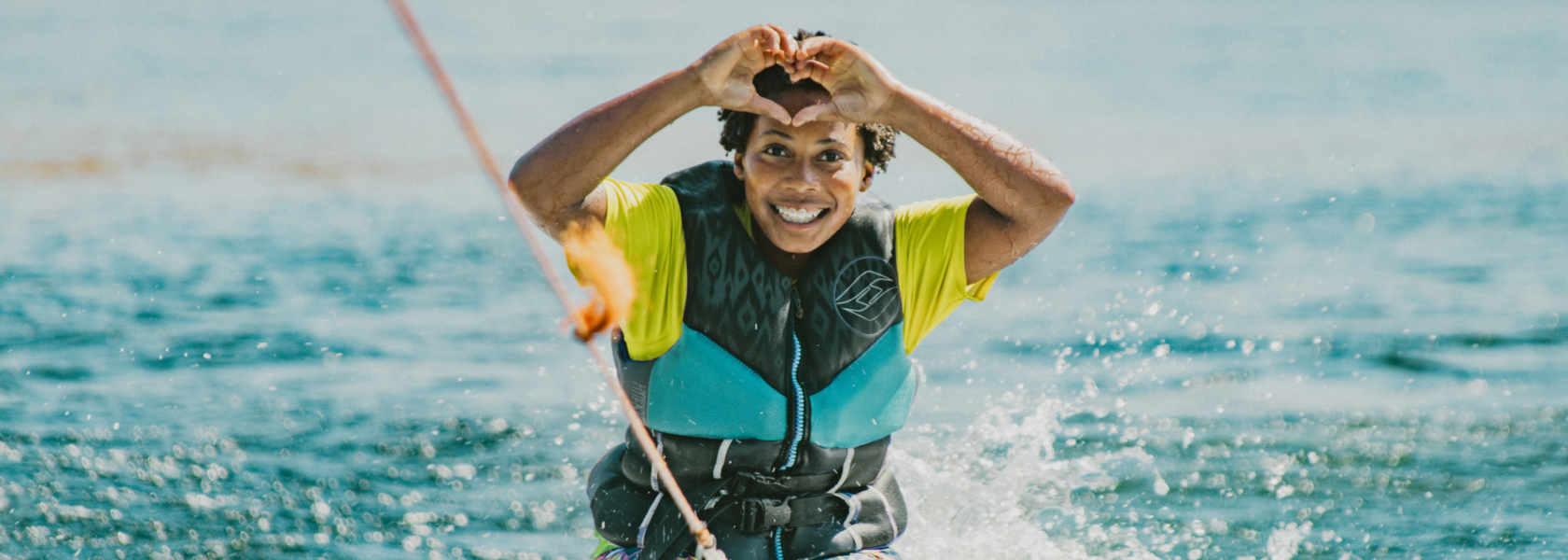 camper having fun on a tube on the lake